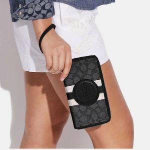 Coach Dempsey Large Phone Wallet In Signature Jacquard With Stripe & Coach Patch